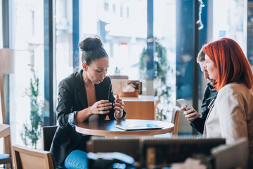 Young attractive people in coffee shop