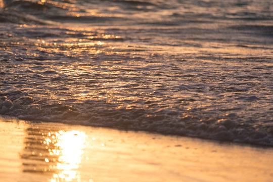 sea waves warm red sunset beach of the ocean