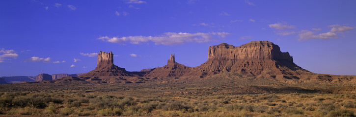 Panoramic view of red buttes and colorful spires of Monument Valley Navajo Tribal Park, Southern Utah near Arizona border