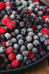 frozen raspberries, blackberries and blueberries close up