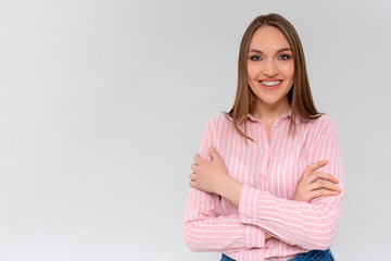 Cheerful young new attractive female employee ready help energized look upbeat confident camera cross arms chest self-assured smiling toothy aim bright successful future, standing white background