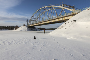 Steel bridge frame close. Bridge over the winter river