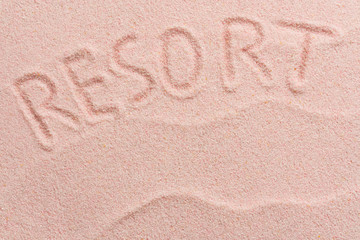 Fototapeta na wymiar RESORT lettering on sand with wave. Minimal exotic Sand, shells, vacation and travel concept, Flat lay top view copy space