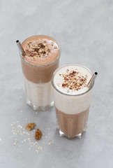 Vegan drink smoothie from dates, nuts, chocolate with smoothies oatmeal in a glass