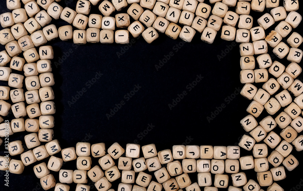 Fototapete cubes on a black background are scattered as a horizontal frame