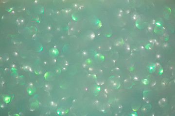 Soft focus, light bokeh on orange background.