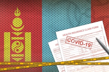 Mongolia flag and Health insurance claim form with covid-19 stamp. Coronavirus or 2019-nCov virus...