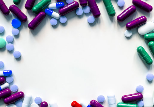 Circle Made Of Pills And Capsules On White Surface