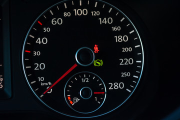 part of car dashboard with speedometer