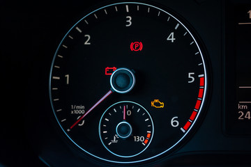 part of car dashboard with speedometer