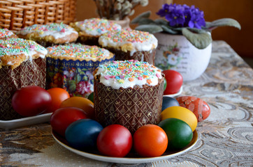 colored eggs and Easter cake on the table