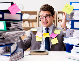 Businessman struggling with multiple priorities