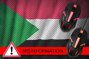Sudan flag and two computer mouses. Misinformation during Coronavirus or 2019-nCov virus concept