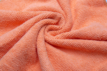 Orangeus microfiber tissue. Texture close up.