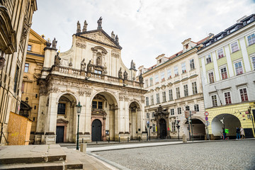 Fototapeta na wymiar Prague, Czech republic - March 19, 2020. Square Krizovnicke namesti in front of entrance to Charles Bridge without tourists during Covid-19 travel ban