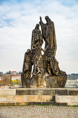 Fototapeta na wymiar Prague, Czech republic - March 19, 2020. Statues of Charles Bridge without tourist during Covid-19 travel ban