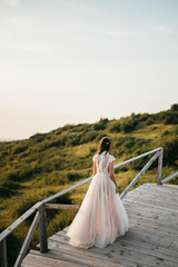 Fototapeta na wymiar Beautiful bride and her wedding dress