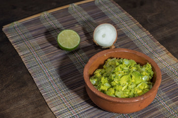 Obraz na płótnie Canvas fresh and organic guacamole to accompany meals