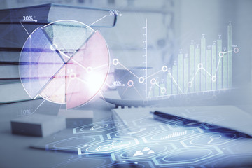 Double exposure of financial chart drawing and desktop with coffee and items on table background. Concept of forex market trading