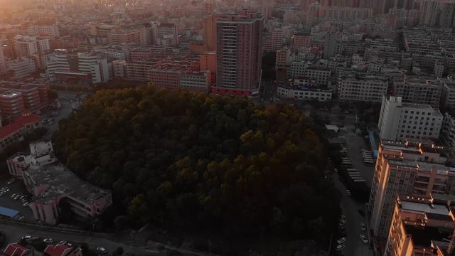 undeveloped land in middle of city China Haifeng drone shot sunrise