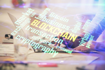 Double exposure of woman hands typing on computer and crypto market theme hologram drawing. Blockchain concept.