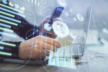 Multi exposure of man's hands holding and using a digital device and data theme drawing. Innovation concept.