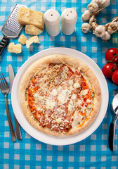 Tasty homemade pizza with prosciutto, cheese and nuts