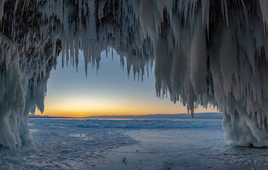 Ice cave on Lake Baikal at sunset, Siberia 