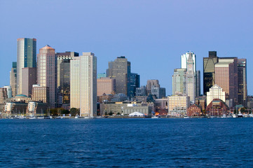 Fototapeta na wymiar Boston Harbor and the Boston skyline at sunrise as seen from South Boston, Massachusetts, New England