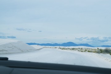 Fototapeta na wymiar Looking at gypsum crystal road in White Sands National Park