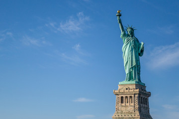 Fototapeta na wymiar Statue of Liberty and Blue Sky