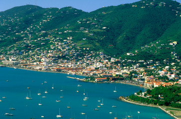 Cliff top view of a seaport and village.  St Thomas West Indies Caribbean