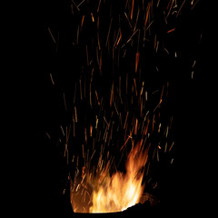 Bonfire flame with bright sparks. Isolated on black background