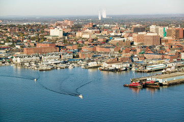 Aerial of downtown Portland Harbor and Portland Maine with view of Maine Medical Center, Commercial street, Old Port and Back Bay.