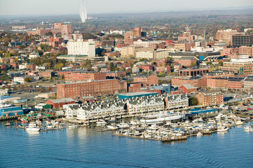 Aerial of downtown Portland Harbor and Portland Maine with view of Maine Medical Center, Commercial...