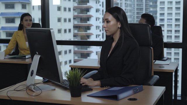 Business people working with desktop computer.