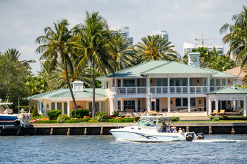 People boating tour by mansions in Fort Lauderdale FL USA - obrazy, fototapety, plakaty