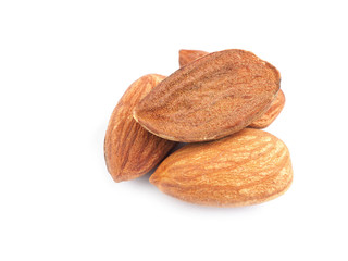 Close up a pile of almonds seeds isolated on a white background. Healthy food..