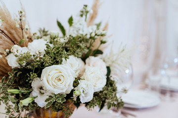 Wedding flowers decoration in the restaurant in pastel colors