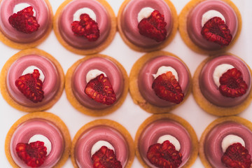 Close up of raspberry individual cupcakes, top view