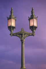 Fototapeta na wymiar Lamps on London Bridge at Lake Havasu, AZ at sunrise