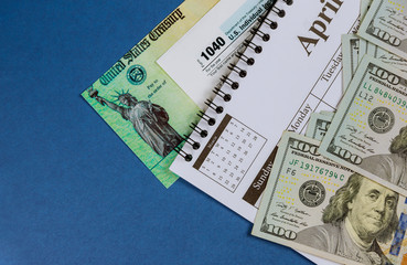 Form 1040 U.S. individual income tax return of spiral calendar one hundred dollar bills