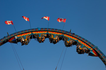 Riders hanging upside down on a roller coaster ride at the CNE Toronto Canada
