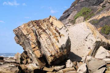 Boulder at the Bottom of a Cliff on a Beach