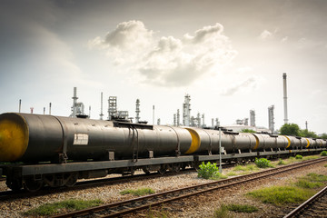 Fototapeta na wymiar Oil transportation train is unloading at oil refinery.