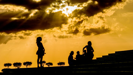 Fototapeta na wymiar silhouette of a girl at sunset