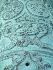 scroll and engraving on aged cannon