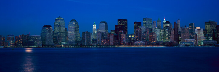 Fototapeta na wymiar Panoramic view of Lower Manhattan skyline, NY where World Trade Towers were located at sunset