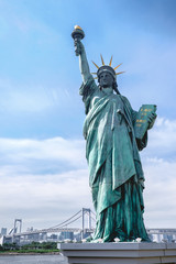  Statue of Liberty replica in Odaiba and Tokyo skyline behind, Japan