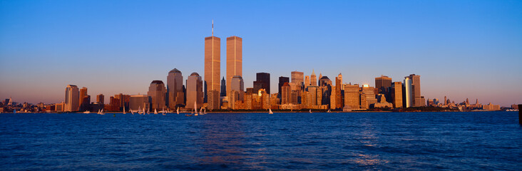 Panoramic view of lower Manhattan and Hudson River, New York City skyline, NY with World Trade Towers at sunset